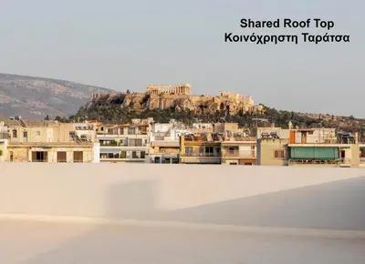 a view of a city with buildings and a mountain at Livinn Acropolis View in Athens