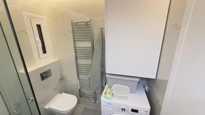 a small bathroom with a toilet and a sink at Filellinon in Athens