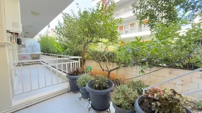 a balcony with a bunch of potted plants on it at Filellinon in Athens
