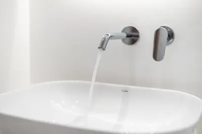 a bathroom sink with a water fountain at Tiko Nina by Greece Apartments in Athens
