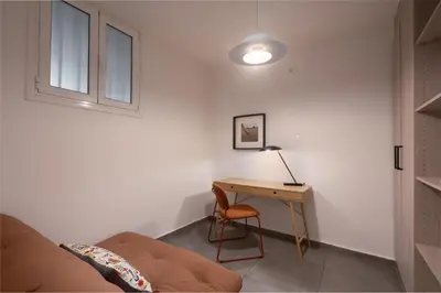 a bedroom with a desk and a bed and a lamp at 2BR Designer Apt Near Metro With Private Garden in Athens