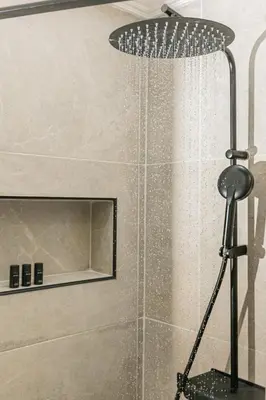 a shower with a shower head in a bathroom at Plantaea Deluxe Studio - Athens Modern Escape in Athens