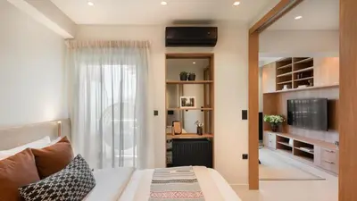 a bedroom with a bed and a television in a room at Voula Urban Escape in Athens