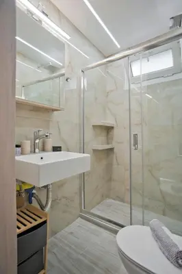 a bathroom with a sink and a shower at The Little House at Moschato 1BR, WiFi, AC in Piraeus