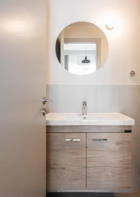 a bathroom with a sink and a mirror at Link by Zoia Living in Athens