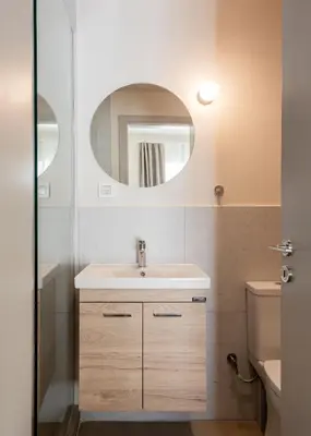 a bathroom with a sink and a mirror at Link by Zoia Living in Athens