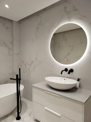 a white bathroom with a sink and a mirror at Amazing Sea View Next To The Beach 2bd Apt in Athens