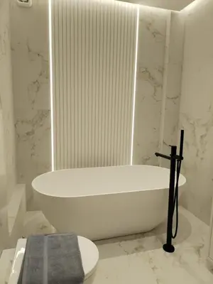 a white bath tub sitting in a bathroom at Amazing Sea View Next To The Beach 2bd Apt in Athens