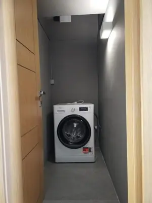 a washer and dryer in a small room at Amazing Sea View Next To The Beach 2bd Apt in Athens