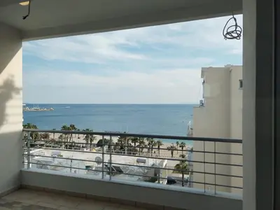 a view of the ocean from the balcony of a condo at Amazing Sea View Next To The Beach 2bd Apt in Athens