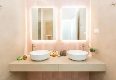 two sinks in a bathroom with two mirrors at Livinn Acropolis View LV in Athens