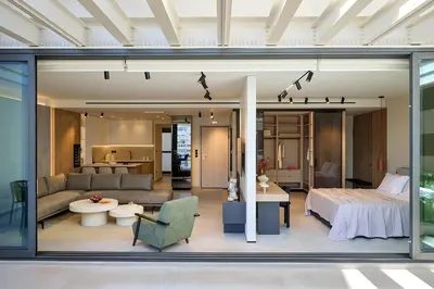 a room with a bed and a living room at Fasma Suites Luxury Apartments in Piraeus in Piraeus