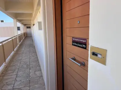 a room with a door with a sign on it at Krystalli 3BR apartment in Voula by ΜΡS in Athens