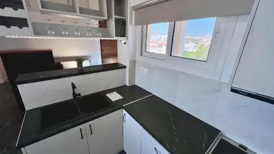 an empty kitchen with a sink and a window at Krystalli 3BR apartment in Voula by ΜΡS in Athens