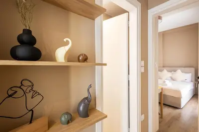 a small apartment with a bedroom and a bed at Whispering Veranda in Athens