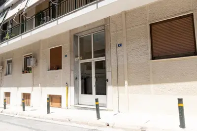 a building with a door on the side of it at Whispering Veranda in Athens