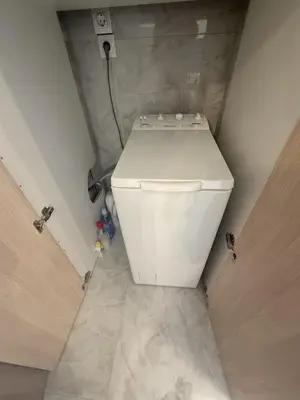 a bathroom with a white toilet in a room at SeaWave Porto Rafti in Porto Rafti