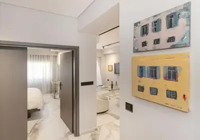 a room with a bed and a painting on a wall at Syntagma Acropolis M4 in Athens