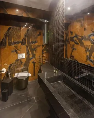a bathroom with a painting of a horse on the wall at Syntagma Acropolis M4 in Athens