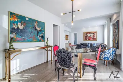 a dining room with a glass table and chairs at Art Acropolis Apartment Georgia in Athens