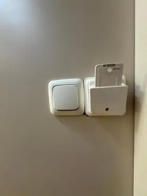 two cell phones are hanging on a wall at Cozy vintage flat in Athens