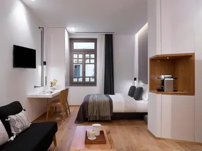 a hotel room with a bed and a desk at InnAthens in Athens