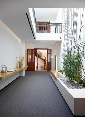 an open hallway with a staircase in a house at InnAthens in Athens