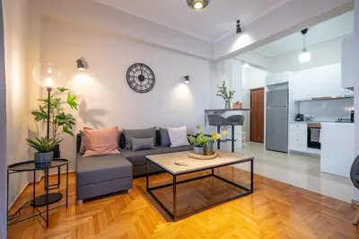 a living room with a couch and a table at Beba's House by ΜΡS in Athens