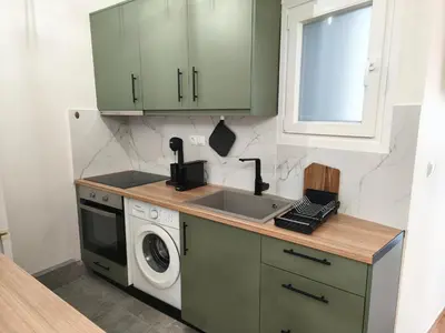 a kitchen with a sink and a washing machine at Studio Σταθμός Λαρίσης 100Mbps , Μπαλκόνι in Athens