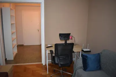 a room with a desk and a chair and a couch at Goudi Athens Retreat in Athens