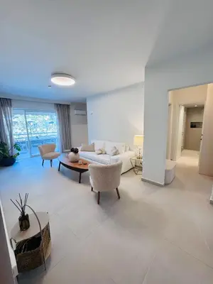 a living room with a couch and a table at Luxury 2bedroom Apartment in Glyfada- Scarlet Vibes Glyfada in Athens