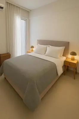 a bedroom with a large bed and a window at Luxury 2bedroom Apartment in Glyfada- Scarlet Vibes Glyfada in Athens