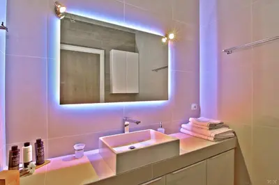 a bathroom with a sink and a mirror at Villa Nelmar in Anavissos
