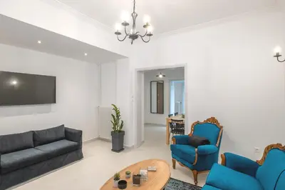 a living room with a couch and a table at Archive, The Art of Living in Athens