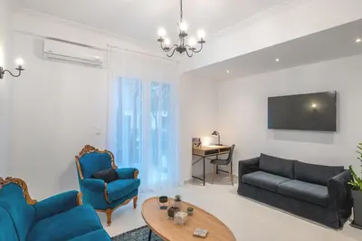 a living room with a couch and a table at Archive, The Art of Living in Athens