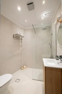 a bathroom with a shower and a sink and a toilet at Archive, The Art of Living in Athens