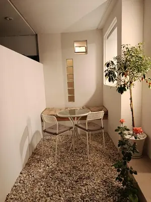 a small room with a table and two chairs at Viktoria's Garden Pavilion in Athens