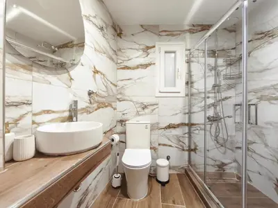 a bathroom with a sink toilet and a shower at Cosy apartment next to Larissa station 100Mbps & Balcony in Athens