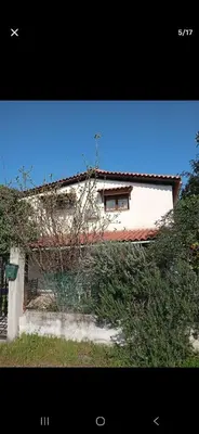 a building with a window on the side of it at Pallini house in Pallíni