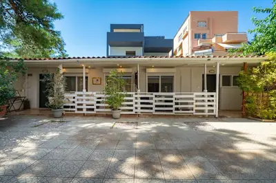 a white fence in front of a house at Lilac Dream in Glyfada by ΜΡS in Athens