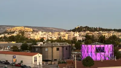 a view of a city with a purple building at Kirki Luxury Loft in Athens