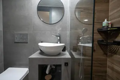 a bathroom with a sink and a mirror at Boho Nest in Glyfada by ΜΡS in Athens