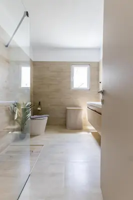 a bathroom with a tub and a sink at Raise Coastal Grand Escape in Athens