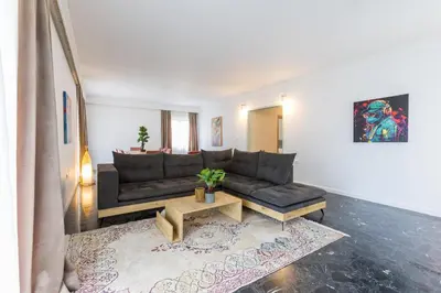 a living room with a couch and a coffee table at Raise Coastal Grand Escape in Athens