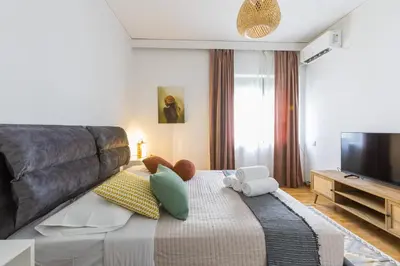 a bedroom with a bed with stuffed animals on it at Raise Coastal Grand Escape in Athens