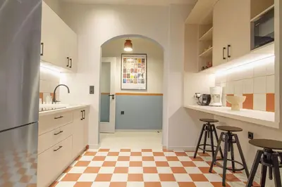a kitchen with a checkered floor at Acropolis Luxury retreat in Athens
