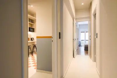 a hallway leading to a living room with a table at Acropolis Luxury retreat in Athens