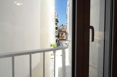 a view from a window of a balcony at Acropolis Luxury retreat in Athens