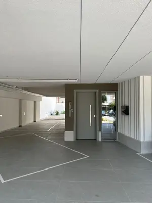 an empty parking lot with a door in a building at Niarchos Elegant Maisonette in Athens