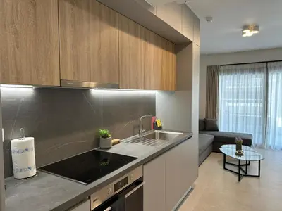 a kitchen with a sink and a counter top at Niarchos Elegant Maisonette in Athens